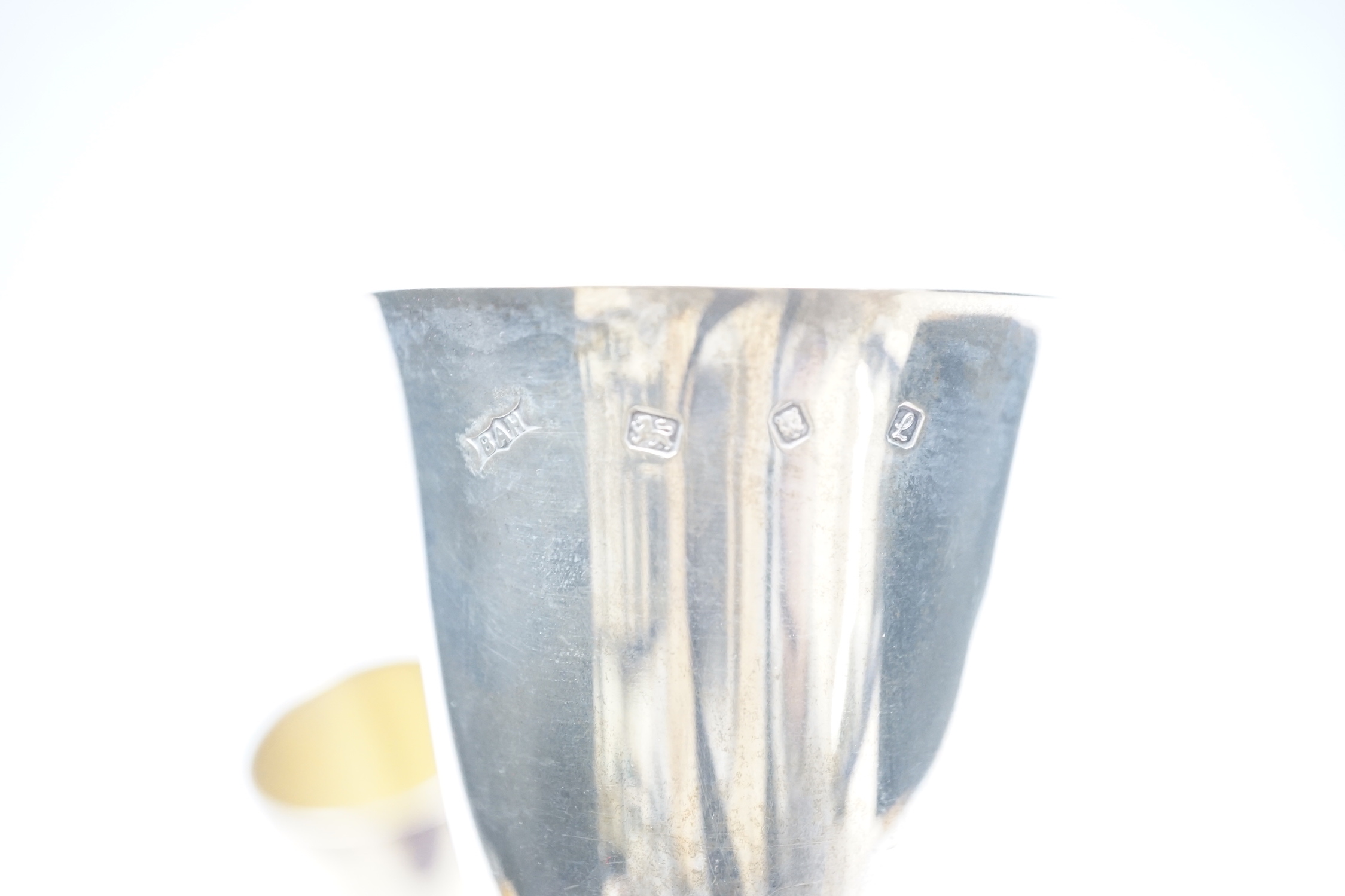 A pair of modern silver commemorative pedestal goblets, '1000 Years of Monarchy', by Mappin & Webb, London, 1973, 13.2cm and three other modern silver goblets, 30.8oz.